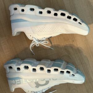 On Running White and Light Blue Athletic Shoes